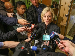 Alberta NDP leader Rachel Notley speaks with media after a meeting with Calgary Mayor Naheed Nenshi at city hall in Calgary, Alta. on Thursday April 30, 2015. Mike Drew/Calgary Sun/Postmedia Network
