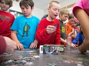 TIM MILLER/THE INTELLIGENCER
Grade 5 students attempt to put together a puzzle at Harmony School on Thursday. The activity was part of an Autism Awareness in Action Day. The idea for the activity came from Grade 6 student, Stamati Sakellis, who has two brothers who have been diagnosed with autism.
