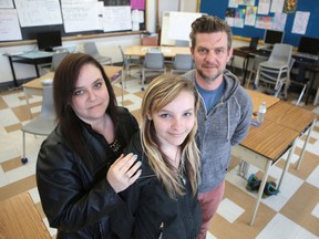 Lyme disease patient Kiara Neill, 12, and her mother Melanie Leclair and teacher Murray Dee say they hope the Take a Bite out of Lyme challenge raises awareness about the disease. They are photographed in Dee's classroom at Rideau Heights Public School. (Elliot Ferguson/The Whig-Standard)