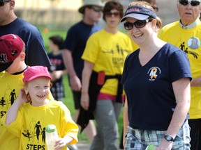 Hannah Whiting, 7, walks with her mom Debbie in Steps for Life 5k walk for victims of workplace tragedy in Sarnia. (The Observer file photo)