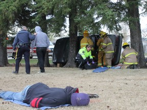 A student plays the role of the deceased victim for Wednesday's mock accident scene in Mannville.