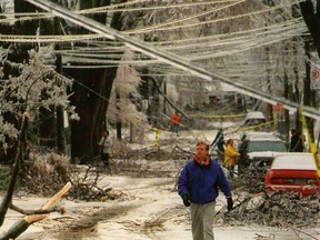 A man walks through the damage cause along Nelson Street by the ice storm in 1998. (Whig-Standard file photo)