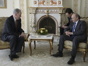 Russian President Vladimir Putin (right) attends a meeting with former Canadian Prime Minister Jean Chretien at the Novo-Ogaryovo residence outside Moscow, April 30, 2015. (ALEXEI NIKOLSKY/RIA Novosti/Reuters)