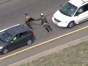 A police officer chases down Christopher David Sullivan after a two-hour carjacking and crime spree in Colorado last year.
(Screenshot from YouTube)