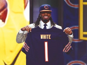 Wide receiver Kevin White holds a Chicago Bears jersey after being drafted by the team on Thursday night. (USA TODAY SPORTS)