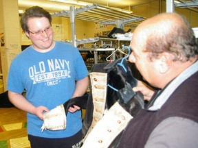 Music teacher Tom Pietrangelo, right, and Arthur Voaden Secondary School student Brad Simpson check out costumes for coming show, Farewell to Broadway. Simpson is singing Edna Turnblad in Hairspray.