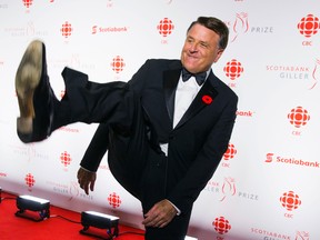 Television personality David Chilton does a kicking motion as he arrives at the Scotiabank Giller Prize awards gala in Toronto, November 10, 2014. Chilton is set to speak at the Imperial Theatrre in Sarnia June 15. It's a fundraiser for St. Clair Child and Youth Services.    REUTERS/Mark Blinch