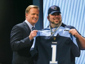 NFL Commissioner Roger Goodell holds up a jersey after the Tennessee Titans chose Marcus Mariota of the Oregon Ducks second overall during the first round of the 2015 NFL Draft in Chicago on April 30. (Jonathan Daniel/Getty Images/AFP)