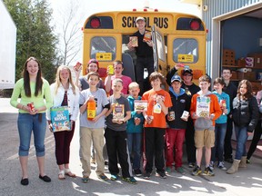 Students from the across the Huron portion of the Huron-Perth Catholic District School Board with just a small fraction of the amount of food their school donated to St. Vincent de Paul in Goderich on April 29. (Steph Smith/Goderich Signal Star)
