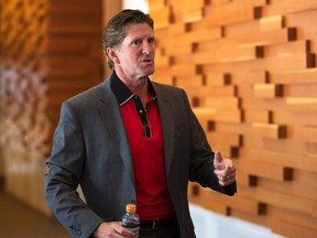 Head coach Mike Babcock arrives at a Hockey Canada news conference in Calgary on August 25, 2013. (REUTERS/Todd Korol)