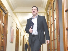 Greek Prime Minister Alexis Tsipras arrives for a cabinet meeting at the Greek parliament in Athens. Greece resumed talks ?  expected to go through to Sunday under a media blackout ? with global creditors on critically-needed bailout funds. (LOUISA GOULIAMAKI, Agence France Presse)