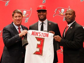 Tampa Bay Buccaneers quarterback Jameis Winston (3), the No. 1 pick in the NFL draft, poses with general manager Jason Licht and head coach Lovie Smith during a press conference Friday in Tampa. (Kim Klement/USA TODAY Sports)