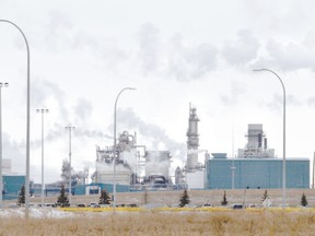 Smokestacks at Shell Canada?s Scotford Manufacturing Centre northeast of Edmonton, Alta., pour flue gasses into the atmosphere. Frank Atkins thinks Ontario?s plan for a cap-and-trade system could make the province more reliant on transfer payments, making Ontario more of a beneficiary of Alberta?s oilsands, which the Scotford upgrader, refinery and hydrocarbon processing sites serve. (Perry Mah, Postmedia Network file photo)