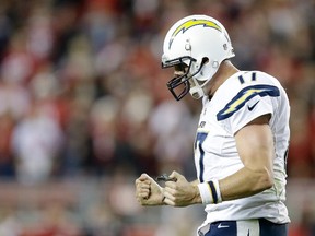 Quarterback Philip Rivers #17 of the San Diego Chargers reacts after throwing a fourth quarter touchdown pass to wide receiver Malcom Floyd #80 against the San Francisco 49ers at Levi's Stadium on December 20, 2014 in Santa Clara, California. (Ezra Shaw/Getty Images/AFP)