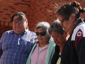 Andrew Mixemong's family members, left to right, Austin Mixemong, Rosanne Monague, Theresa Vanderstett, Kimberley Mixemong grieve outside of court after hearing the verdict.