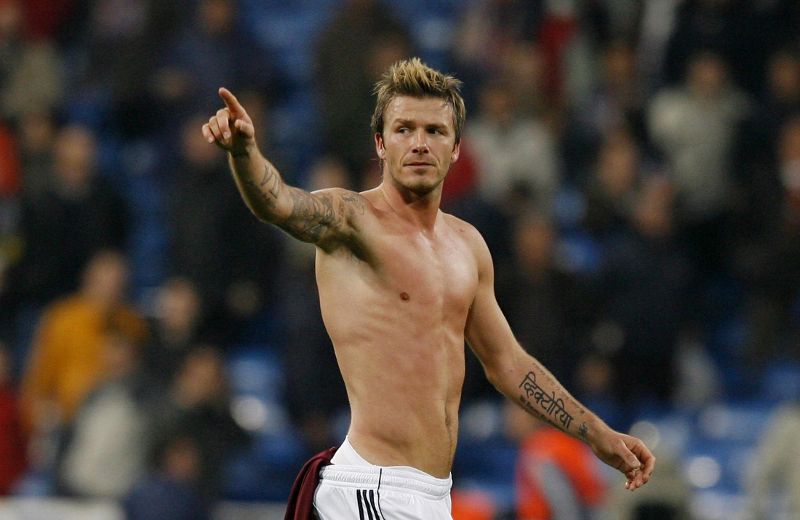 English soccer player David Beckham holds up his new jersey as he is  introduced as the newest member of the Los Angeles Galaxy soccer team in  Carson, California on July 13, 2007. (