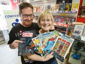 The husband and wife team of Gord Mood and Carol Vandenberg have loaded up to be able to dole out free comic books at L.A. Mood Comics and Games during Saturday?s annual Free Comic Book Day. (DEREK RUTTAN, The London Free Press)