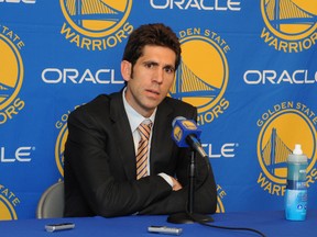 Bob Myers, the new general manager of the Golden State Warriors, speaks to members of the media before a game against the San Antonio Spurs on April 26, 2012 at Oracle Arena in Oakland, California. (Garrett Ellwood/NBAE via Getty Images/AFP)