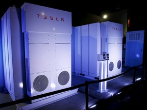 Tesla Energy batteries for businesses and utility companies are pictured providing energy for the Tesla Motors Powerwall Home Battery event in Hawthorne, California April 30, 2015. Tesla Motors Inc unveiled Tesla Energy - a suite of batteries for homes, businesses and utilities - a highly-anticipated plan to expand its business beyond electric vehicles. REUTERS/Patrick T. Fallon