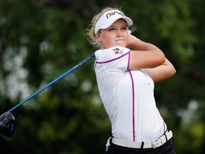 IRVING, TX - MAY 01: Brooke M. Henderson of Canada hits a shot on the seventh hole during Round Two of the 2015 Volunteers of America North Texas Shootout Presented by JTBC at Las Colinas Country Club on May 1, 2015 in Irving, Texas.   Tom Pennington/Getty Images/AFP== FOR NEWSPAPERS, INTERNET, TELCOS & TELEVISION USE ONLY ==