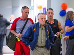 World War Two veteran Art Boon, his son Rick Boon, and grandson Cpl. Jamie Boon are ready to fly to the Netherlands as they walk to the departure gate at Toronto Pearson International Airport on May 1, 2015.  (Ernest Doroszuk/Toronto Sun)