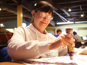 Gino Donato/The Sudbury Star      
Laurette Servant plays bingo at the Boardwalk Gaming Centre in Val Caron on Thursday.