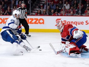 Montreal Canadiens goalie Carey Price (right) makes a save on Tampa Bay Lightning forward Nikita Kucherov during overtime in Game 1 of their second-round playoff series Friday at the Bell Centre. (Eric Bolte/USA TODAY Sports)