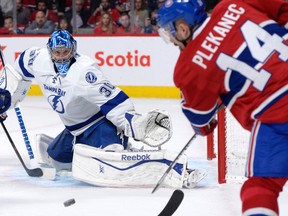Montreal Canadiens forward Tomas Plekanec (14) shoots the puck against Tampa Bay Lightning goalie Ben Bishop (30) on May 1. (USA TODAY Sports)