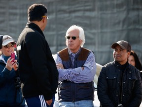 Bob Baffert, talking outside the barn during morning training, will be hoping for a 1-2 finish in the Kentucky Derby with Dortmund and American Pharoah. (AFP)