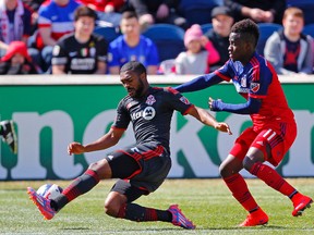 Toronto FC defender Ashtone Morgan, trying to control the ball during a game earlier this season in Chicago, becomes the first 100-cap player in the team’s nine-year history today. (USA TODAY SPORTS)
