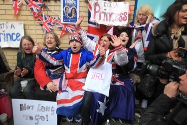 Royal fans celebrate at the Lindo Wing after the announcement of Catherine, e Duchess of Cambridge and Prince William are new parents after she gave birth to a baby girl. (David Sims/WENN.com)