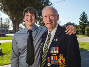 Veteran merchant navy seaman Ray Cameron, 89, and his grandson Josh Perin, 17, pose for a photo outside of Cameron's home on April 28, 2015. They are both heading  to Holland with Veterans Affairs Canada for the 70th anniversary of the Liberation of the Netherlands. (Ernest Doroszuk/Toronto Sun)
