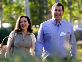 Facebook COO Sheryl Sandberg is seen with her late husband SurveyMonkey CEO David Goldberg in a file photo. (REUTERS/Rick Wilking)