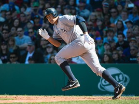 New York Yankees designated hitter Alex Rodriguez (13) runs out a base hit against the Boston Red Sox at Fenway Park. The Yankees won 4-2. Gregory J. Fisher-USA TODAY Sports