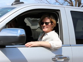 Andree Pendergast test-drives a vehicle at Holy Cross Catholic Secondary School as part of a Buick for Students initiative to raise money for a new basketball court in Kingston, Ont. on Saturday May 2, 2015. Steph Crosier/Kingston Whig-Standard/Postmedia Network