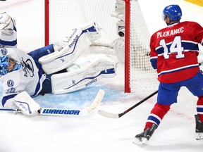 Tampa Bay Lightning goalie Ben Bishop (30) makes a save against Montreal Canadiens centre Tomas Plekanec in Game 1. (Jean-Yves Ahern-USA TODAY Sports)