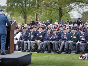 Canadian Second World War veterans look on as Canadian Major-General Richard Rohmer (L) speaks at the Government of Canada ceremony of remembrance at the Canadian war cemetery in Groesbeek, the Netherlands, May 3, 2015. REUTERS/Michael Kooren