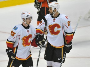 Calgary Flames centre Sam Bennett (63) celebrates with defenceman Deryk Engelland (29) his goal scored against the Anaheim Ducks during the third period in game one of the second round of the 2015 Stanley Cup Playoffs at Honda Center April 30, 2015. (Gary A. Vasquez-USA TODAY Sports)