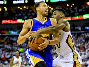 New Orleans Pelicans guard Norris Cole (30) fouls Golden State Warriors guard Stephen Curry (30) during the first half in game four of the first round of the NBA Playoffs at the Smoothie King Center April 25, 2015 in New Orleans. (Derick E. Hingle-USA TODAY Sports)