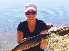 Amy Nesbitt shows a lake trout she caught during ice out this spring. The 21-year-old Sturgeon Falls native is a talented tournament angler with several Top 10 finishes to her credit.
