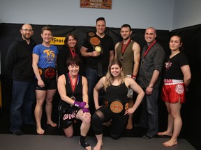 Team Shredder athletes show off their hardware, front row, Lynn Venne and Erika Hawke, back row, coach Yves Charette, Ginny Denomme, Patty Spry, Mathieu Grainger, Troy Kennedy, Dan Dechaine and coach Emilie Charette on Thursday.