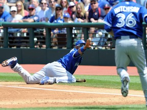 Toronto Blue Jays first baseman Edwin Encarnacion (10) tosses the ball to starting pitcher Drew Hutchison (36) to force out Cleveland Indians left fielder Michael Brantley (not pictured) on May 3. (USA Today Sports)