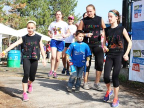 Walkers leave the Dow People Place during Sunday's Walk So Kids Can Talk to raise $30,000 for the national program to aid children seeking help. Photo taken Sunday, May 3, 2015 at Sarnia, Ontario. (NEIL BOWEN/ SARNIA OBSERVER/POSTMEDIA NETWORK)