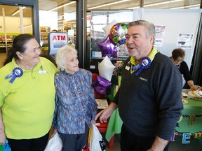 ill and Louise McMillan say farewell to longtime customer Milly Hancock at their Freshco grocery store on North Front Street Saturday. The McMillan's have sold the store and Bill is opening a new chapter after 51 years in the grocery business including more than 15 years as a store owner.