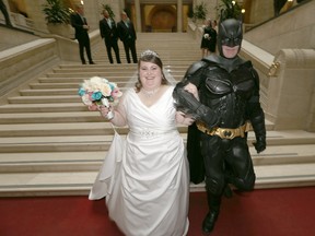 Jenna St. Laurent was surprised by Batman during her wedding photo shoot at the Legislative Building in Winnipeg on Saturday, May 2, 2015. Darren Marrese dresses up as Batman and attends local events. (Chris Procaylo/Winnipeg Sun)