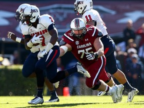 Will Sport #75 of the South Carolina Gamecocks dives after Brandon Bridge #7 of the South Alabama Jaguars after Bridge makes an interception during their game at Williams-Brice Stadium on November 22, 2014 in Columbia, South Carolina. (Streeter Lecka/Getty Images/AFP)