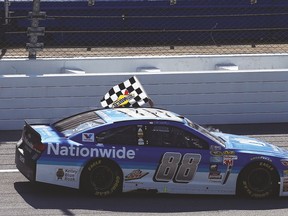 Dale Earnhardt Jr., in the No. 88 Nationwide Chevrolet, celebrates with the checkered flag after winning the NASCAR Sprint Cup series GEICO 500 at Talladega on Sunday. (AFP)