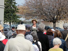 Laura Murray, professor of cultural studies and English at Queen's University, leads approximately 100 residents on Bagot Steet as part of the inaugural Jane's Walk in Kingston on Sunday. (Steph Crosier/The Whig-Standard)