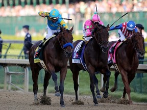 Victor Espinoza rides American Pharaoh (left) to the win at the Kentucky Derby on Saturday. The duo will now head to Baltimore for the Preakness Stakes. (USA TODAY SPORTS)
