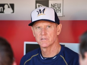 Manager Ron Roenicke #10 of the Milwaukee Brewers speaks to the media in the dugout before their game against the Cincinnati Reds at Great American Ball Park on April 28, 2015 in Cincinnati, Ohio. (Jamie Sabau/Getty Images/AFP)
== FOR NEWSPAPERS, INTERNET, TELCOS & TELEVISION USE ONLY ==